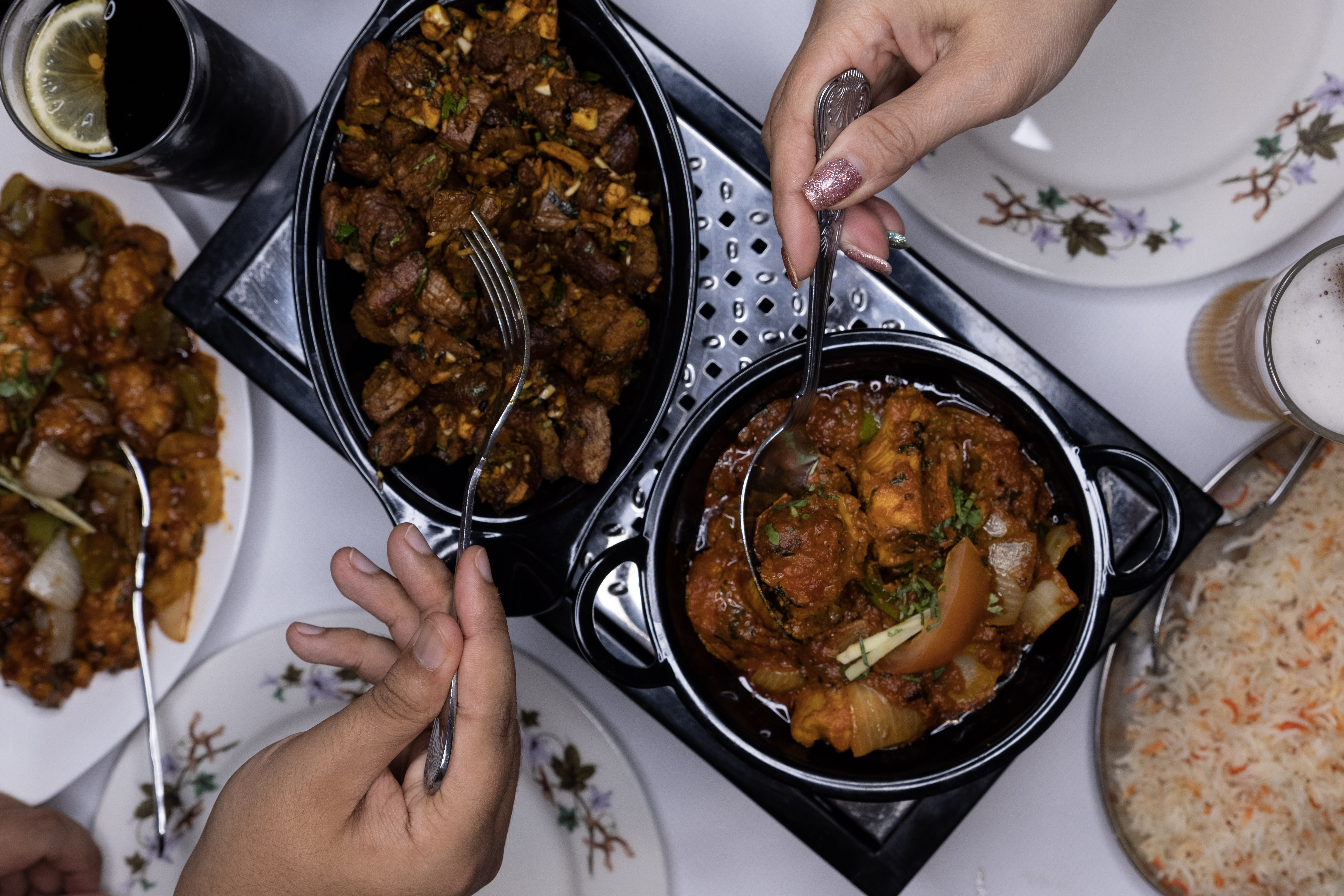 Friends sharing a meal at The Great Kathmandu